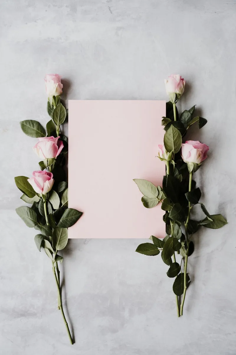 Detail of pastel pink gift wrapping paper with floral accent